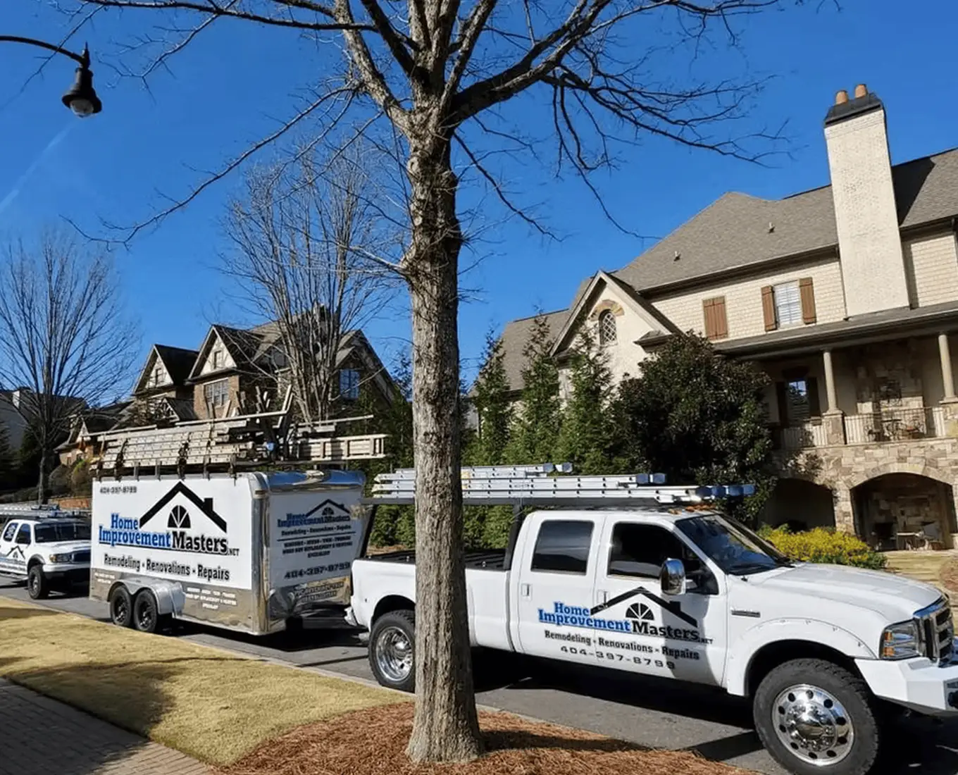 home improvement company trucks lining up in residential neighborhood in Canton, GA for home improvement projects