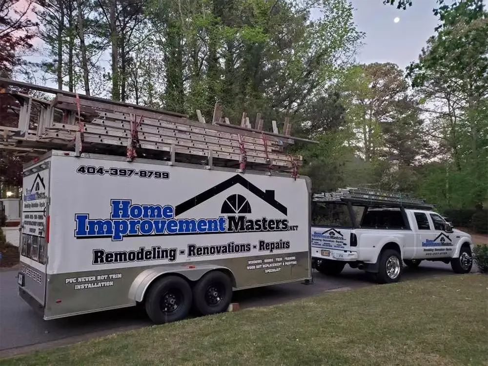 home improvement master truck with trailer carry ladders on top in canton ga