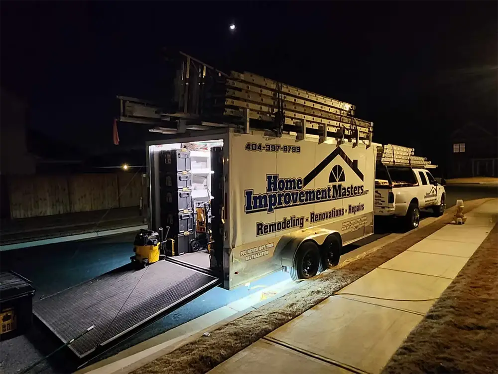 truck with home improvement mater trailer at night in canton ga