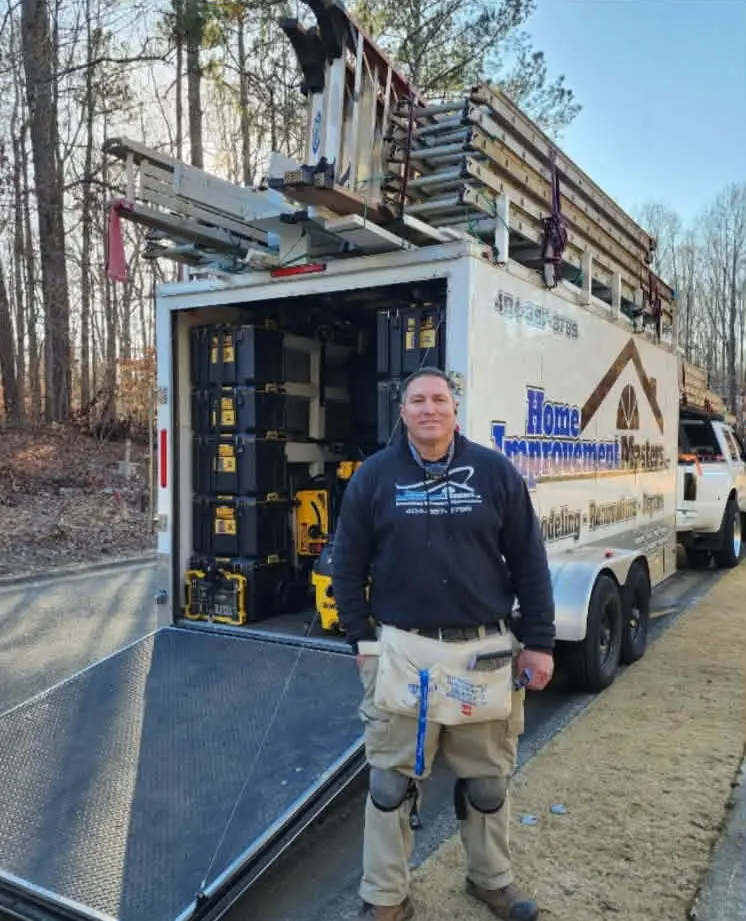 graig next to home improvement master truck and trailer in canton ga