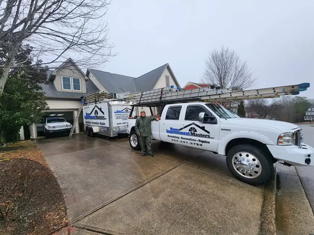 craig by his home improvement master truck and trailer on house driveway in canton ga