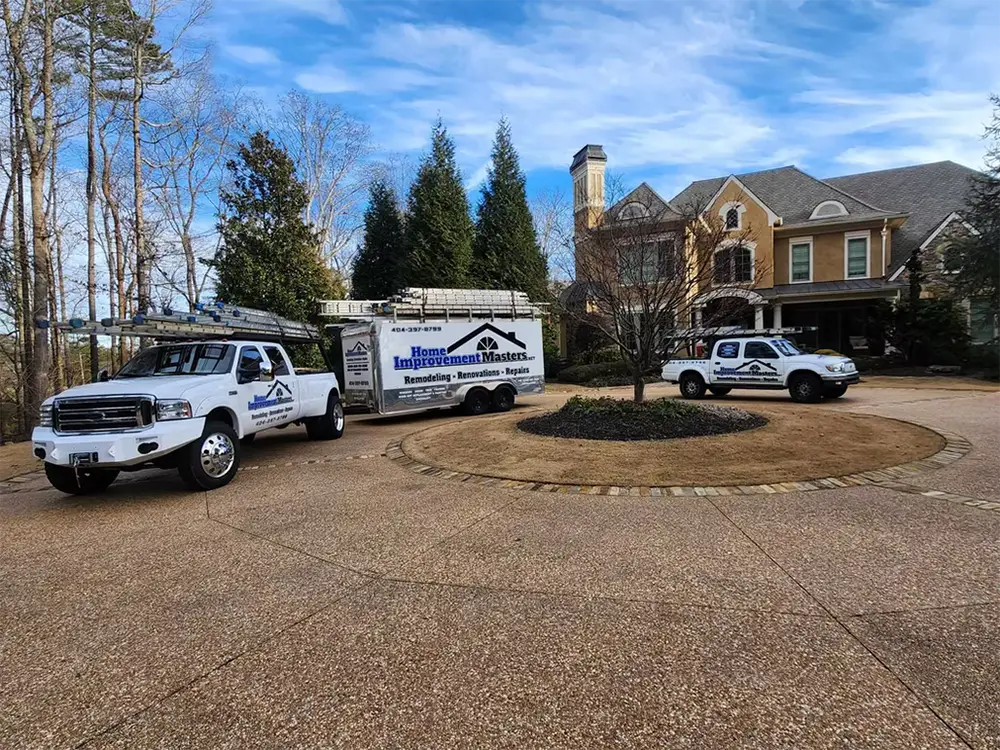 home improvement master truck with trailer and truck park next to house in canton ga